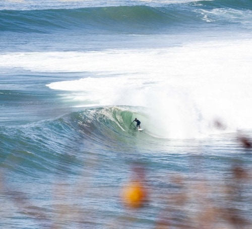 Sufer in barrel in Coxos