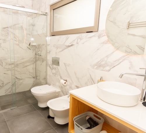 Modern looking bathroom with marble finishes